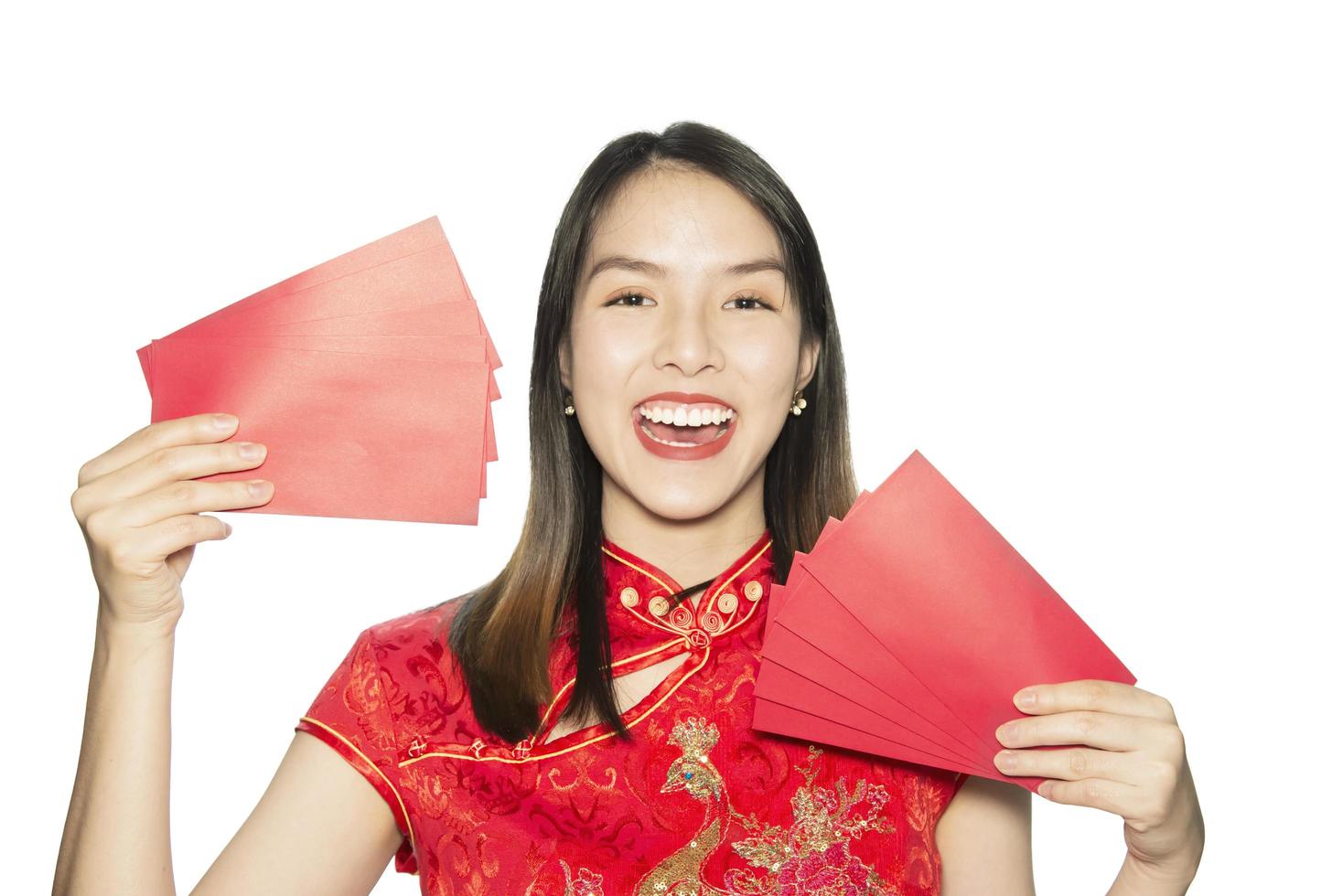 Happy Asian lady shopping in Chinese suite isolated over white copy space - woman day concept photo