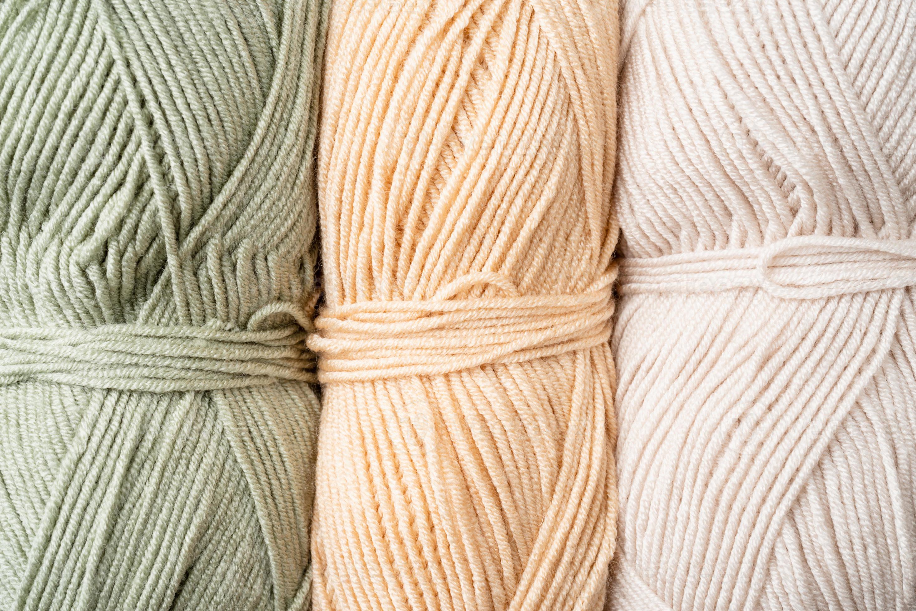 pastel colored yarn wool on shopfront. Knitting background, a lot of