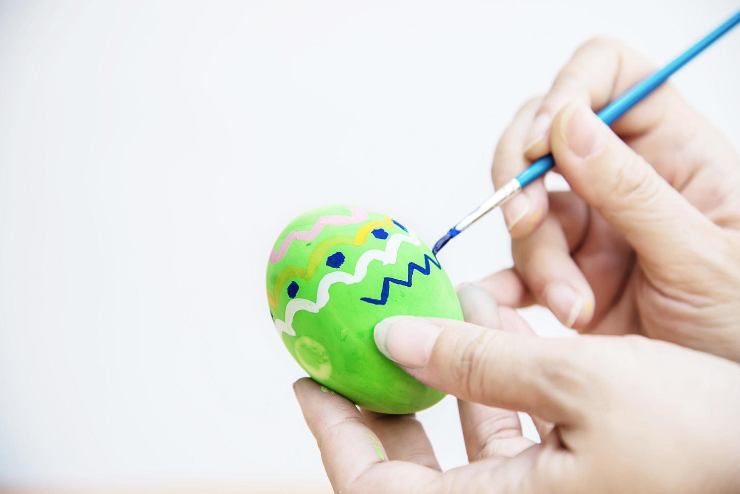 People painting colorful Easter eggs - Easter holiday celebration concept photo