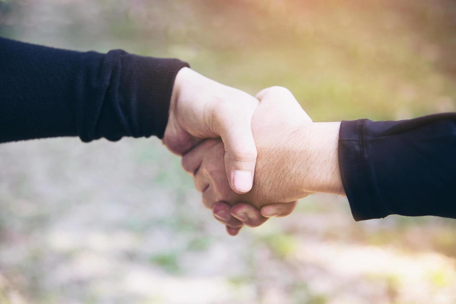 Man touching - holding hand together for success commitment work concept photo