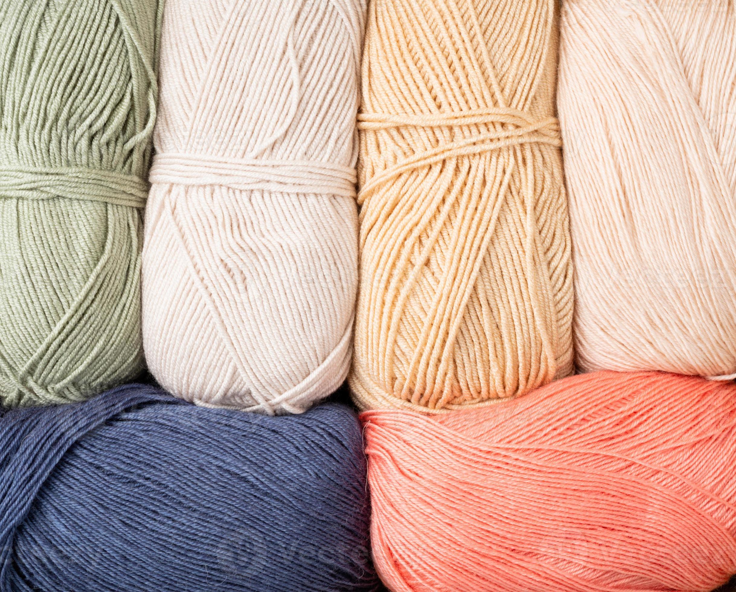 pastel colored yarn wool on shopfront. Knitting background, a lot of