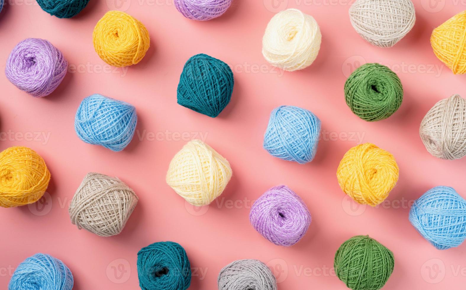 bright and colorful yarn wool pattern on bright background, top view flat lay photo