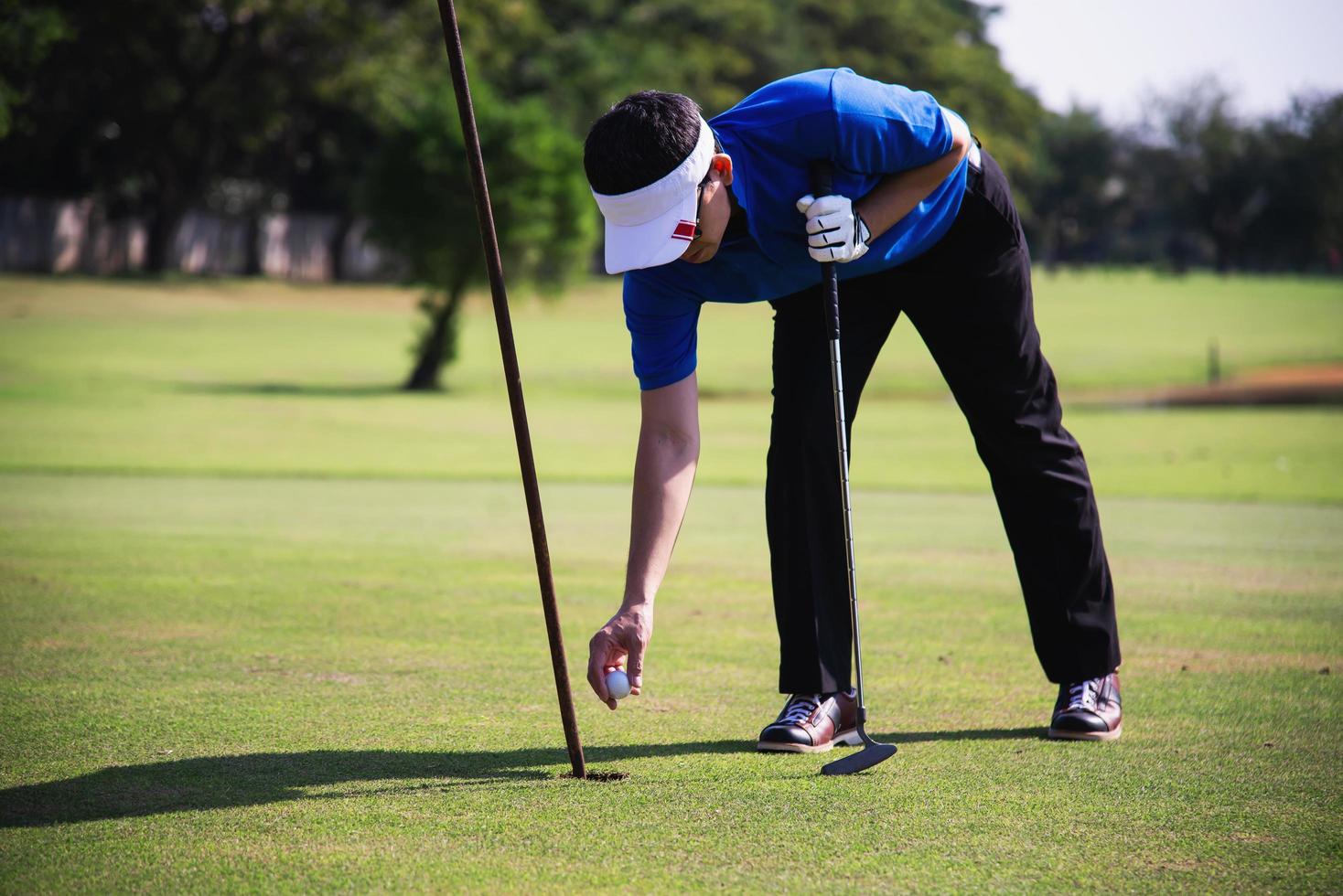 Man play outdoor golf sport activity - people in golf sport concept photo