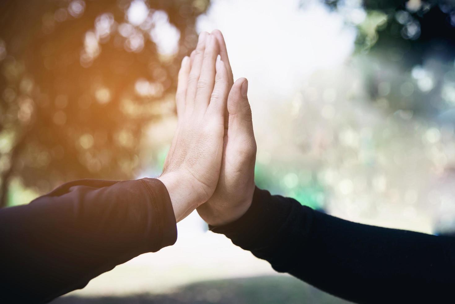 Man touching - holding hand together for success commitment work concept photo