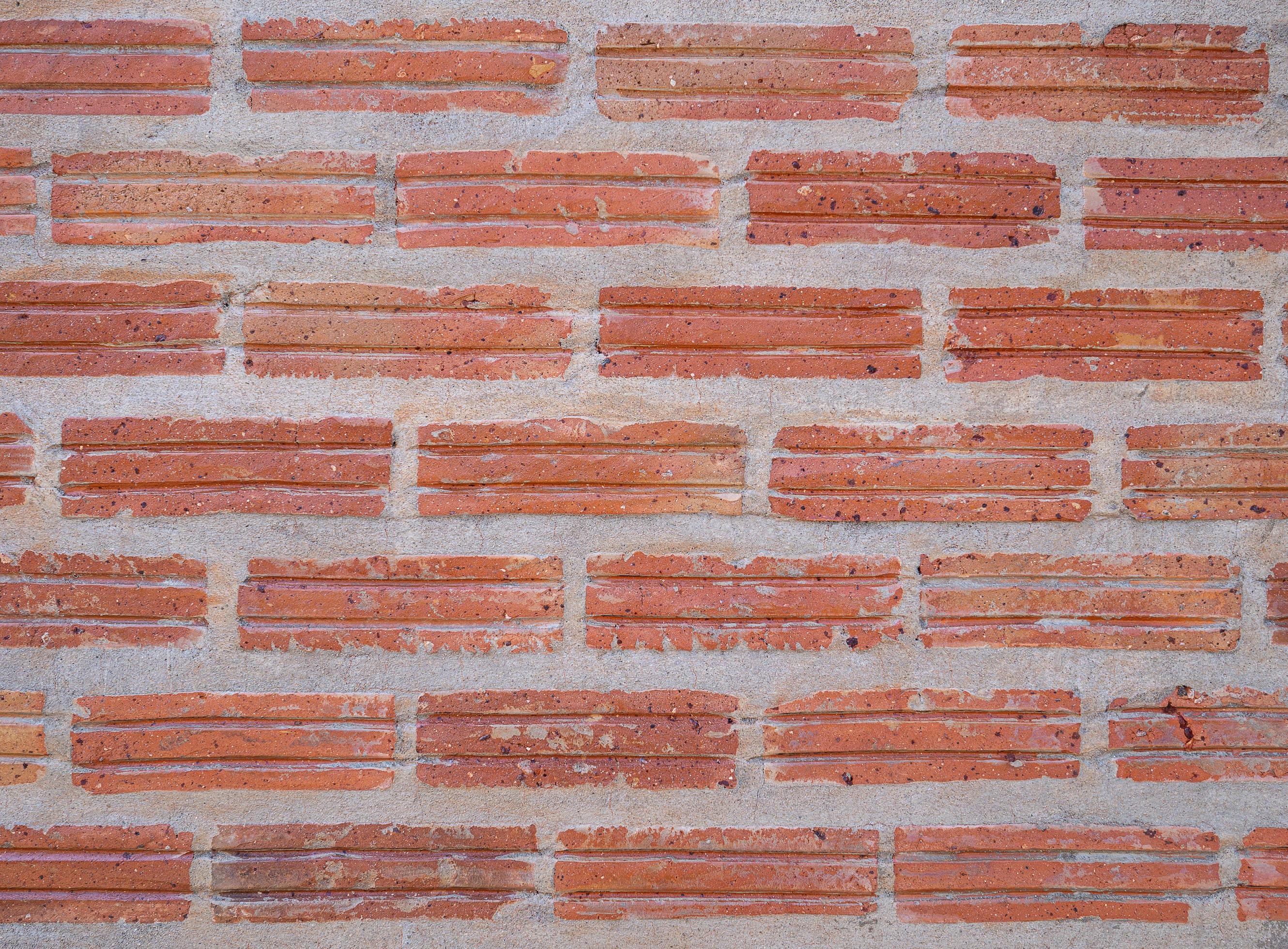 Closeup of the red brick wall background. Exterior design texture