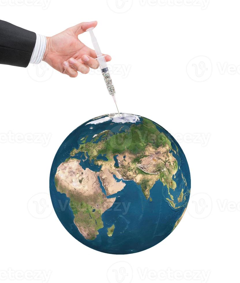 hand holding syringe filled with currency photo