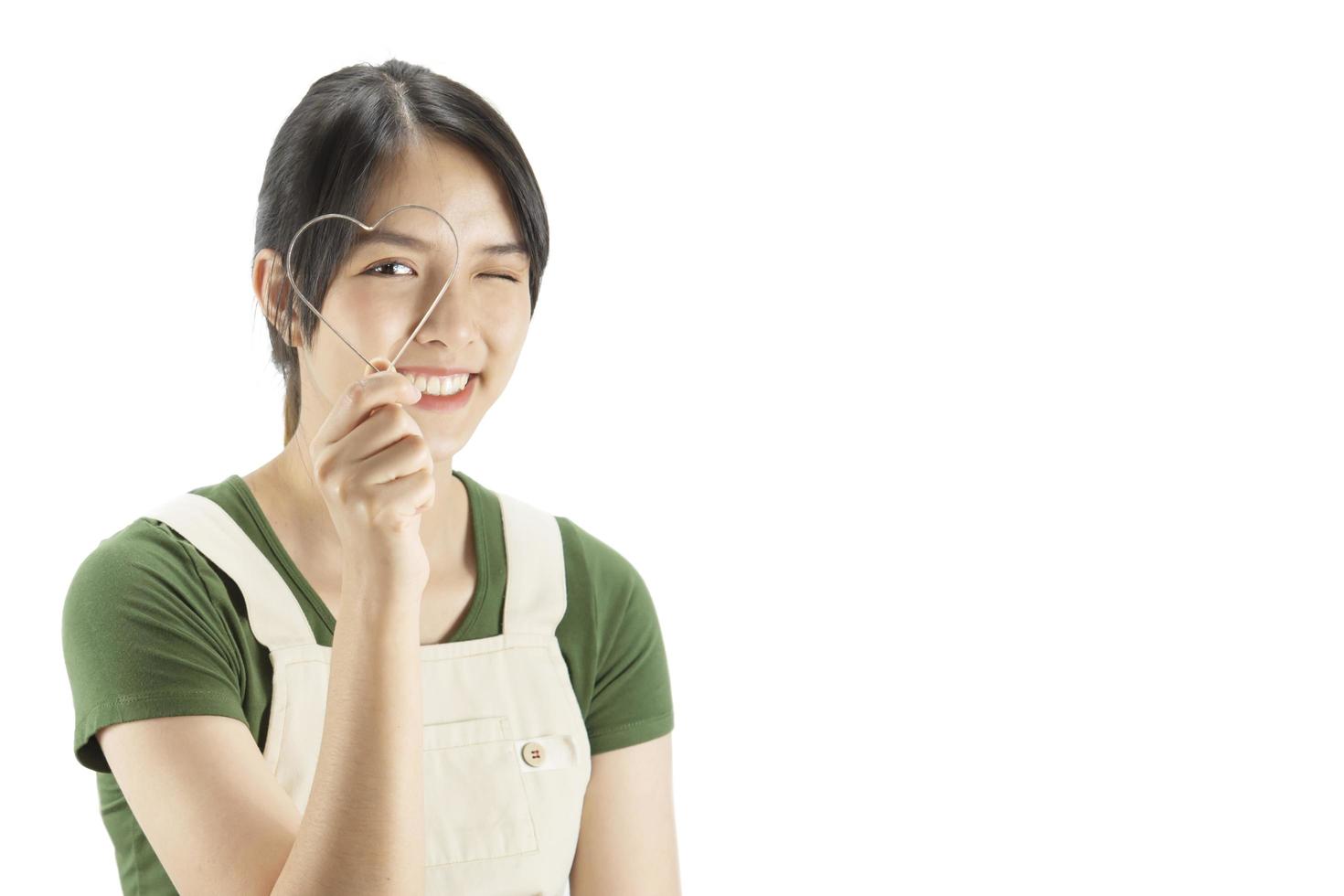 Happy lady holding kichen stuff over copy space background - people home made food preparation concept photo