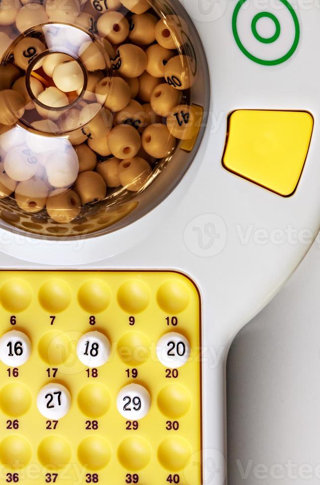 electronic bingo game with balls to play. Vertical image viewed from