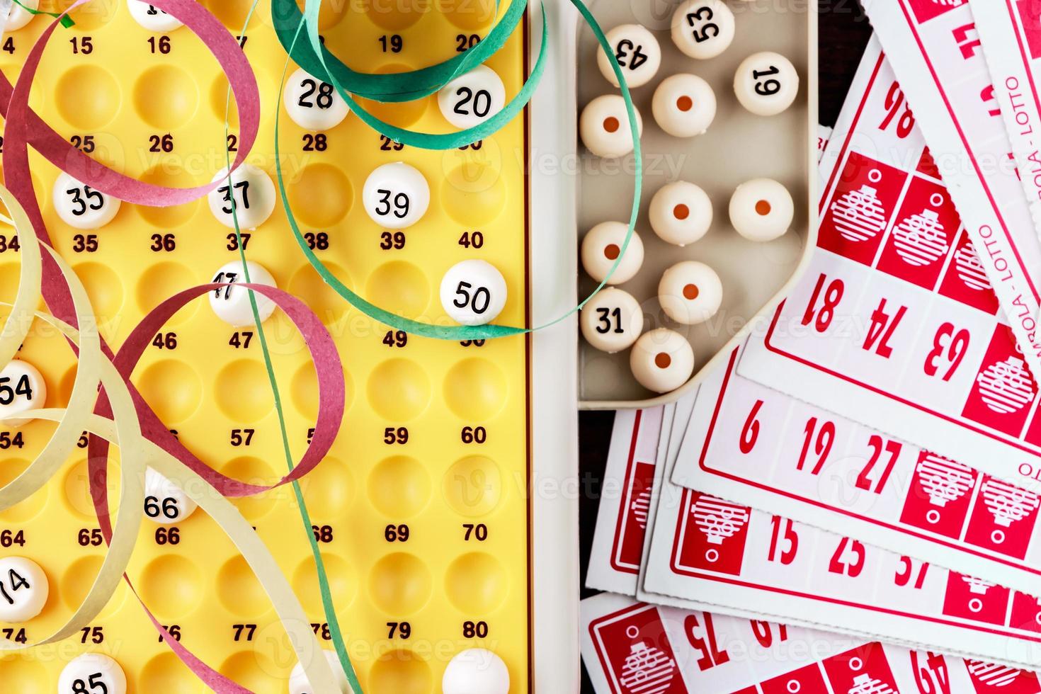 Bingo game with cards to play and serpentines. Horizontal image viewed from above. photo