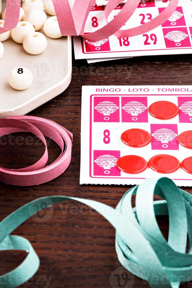 Bingo game with cards to play and serpentines. Vertical image. photo