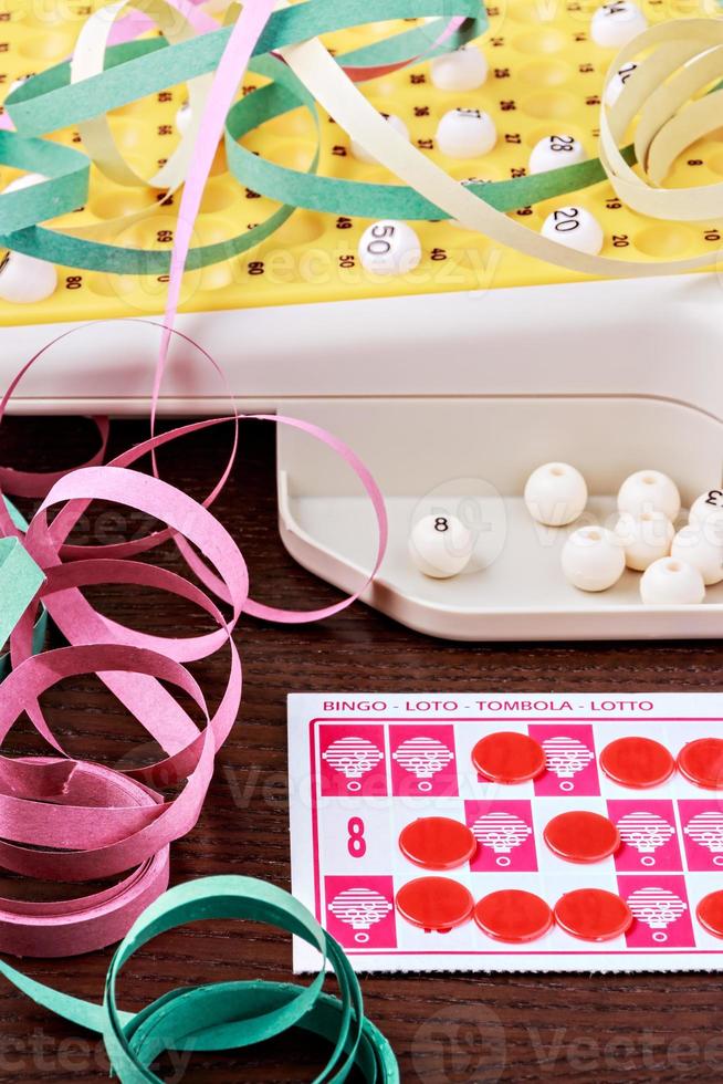 Bingo game with cards to play and serpentines. Vertical image. photo