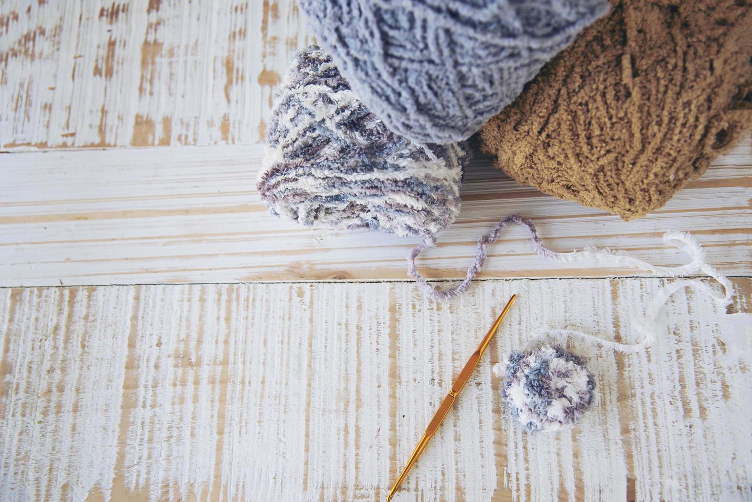 Woman making lovely bunny doll from yarn  - Easter holiday celebration concept photo