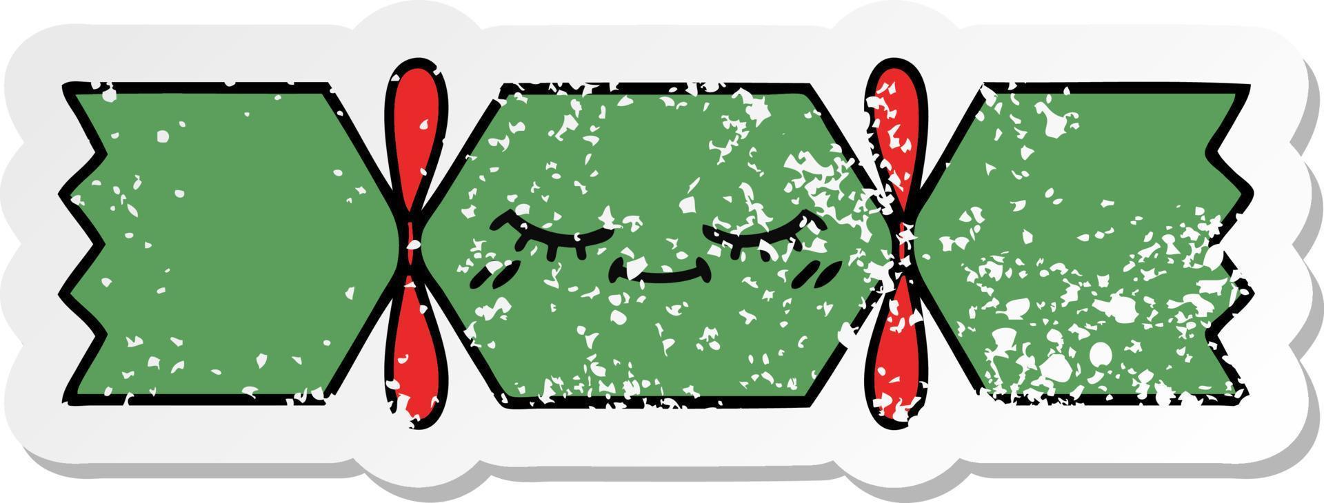 distressed sticker of a cute cartoon christmas cracker vector