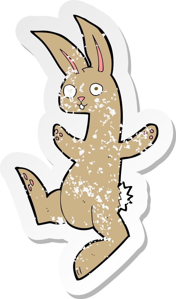 retro distressed sticker of a funny cartoon rabbit vector