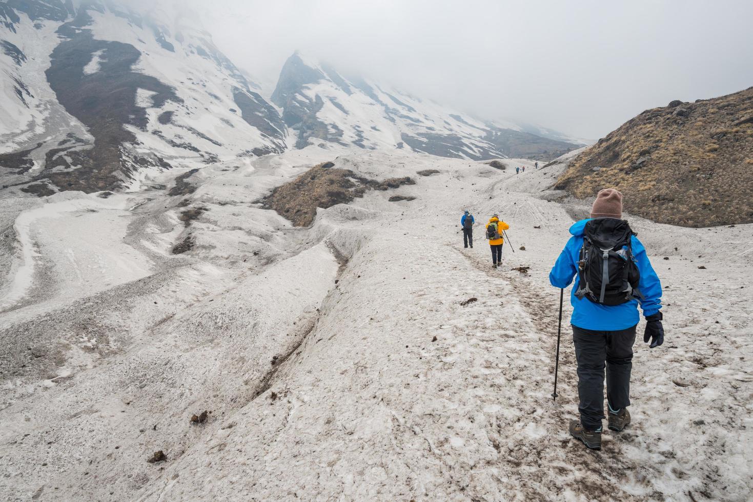 Tourist trekking in Annapurna sanctuary route in winter season of Nepal. Annapurna Sanctuary Trek is most popular trek destination of Annapurna region. photo