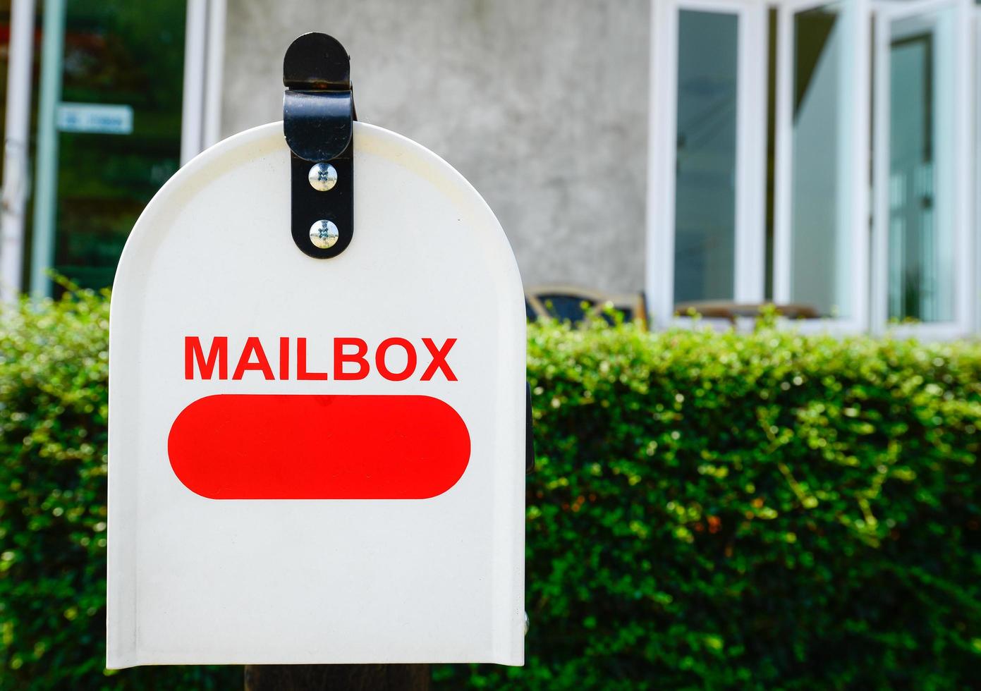 Close up of the mail box is a box outside a person's house where letters are put. photo