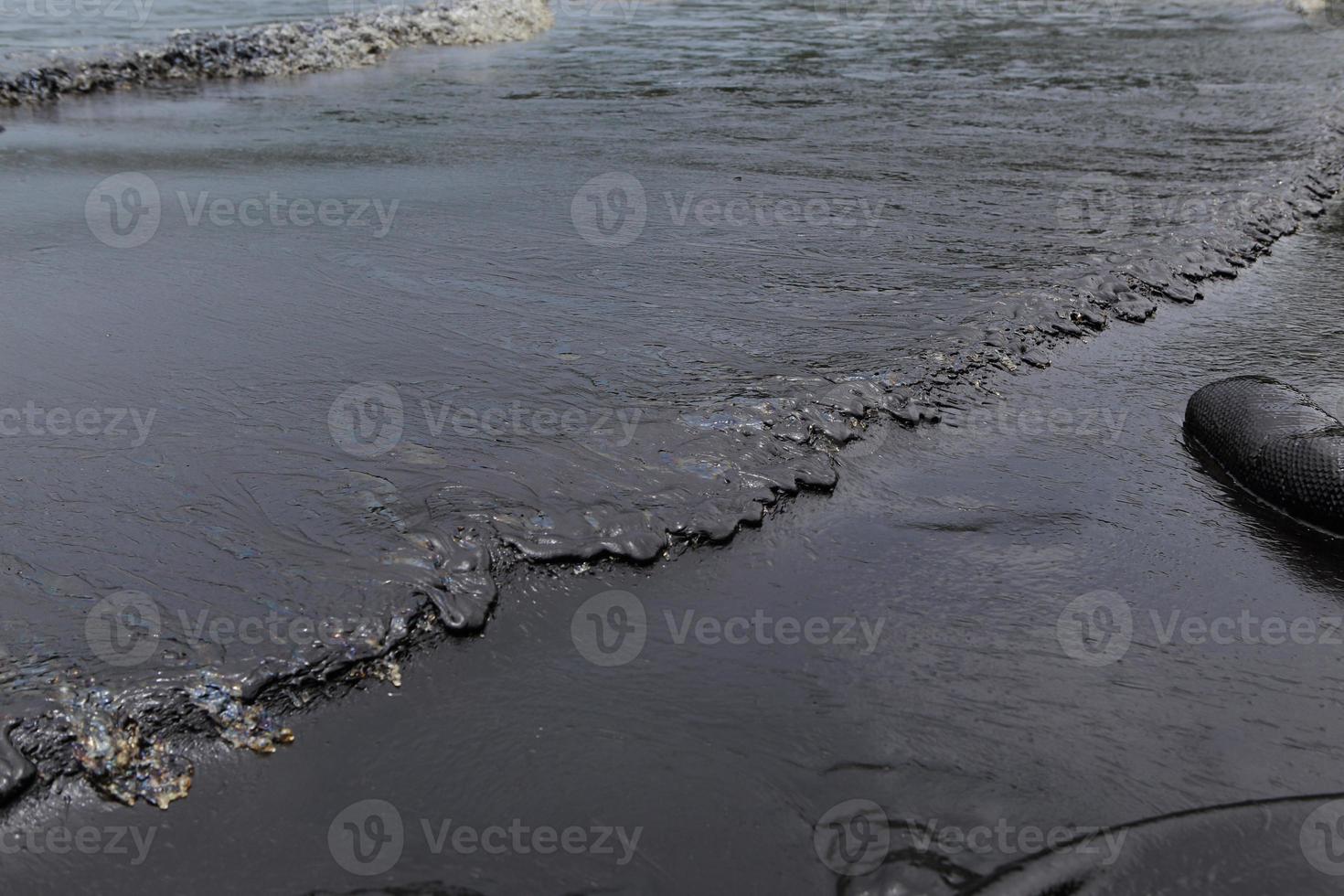 crude oil spill on the beach photo