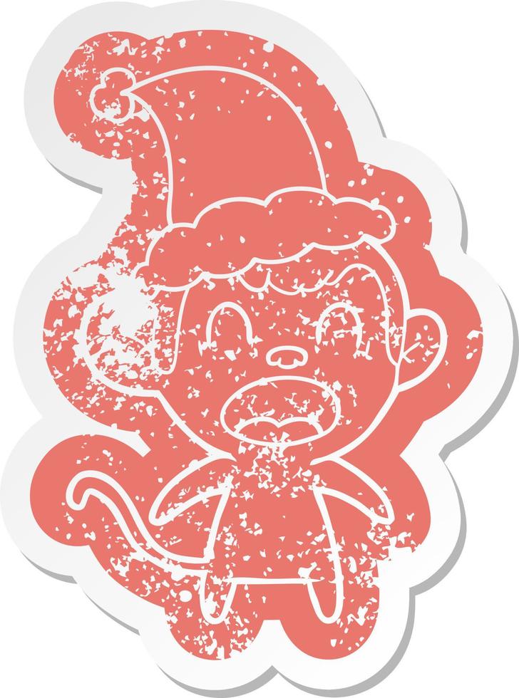 shouting cartoon distressed sticker of a monkey wearing santa hat vector