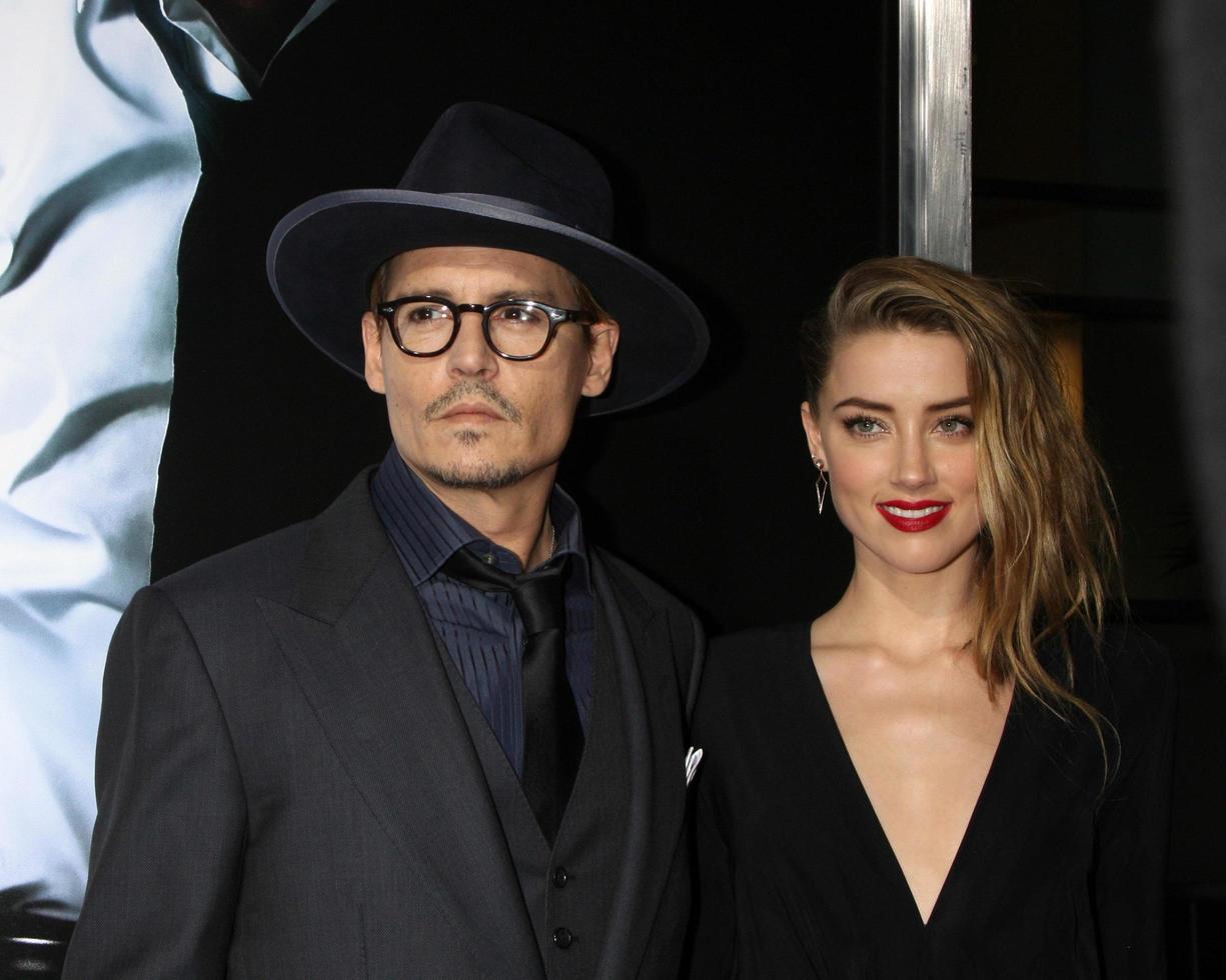 LOS ANGELES, FEB 12 -  Johnny Depp, Amber Heard at the 3 Days to Kill LA Premiere at ArcLight Hollywood Theaters on February 12, 2014 in Los Angeles, CA photo
