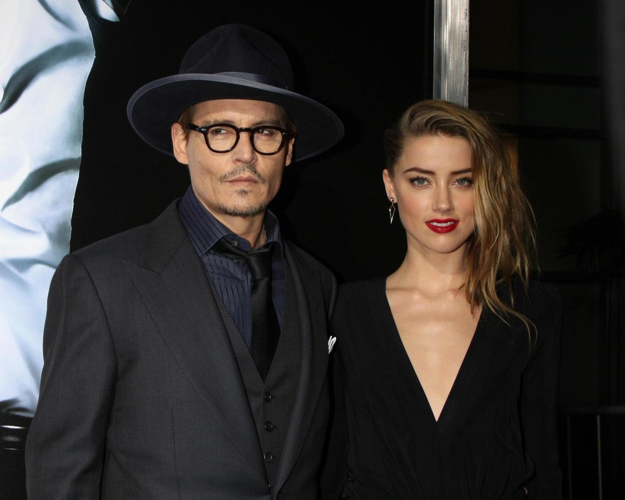 LOS ANGELES, FEB 12 -  Johnny Depp, Amber Heard at the 3 Days to Kill LA Premiere at ArcLight Hollywood Theaters on February 12, 2014 in Los Angeles, CA photo