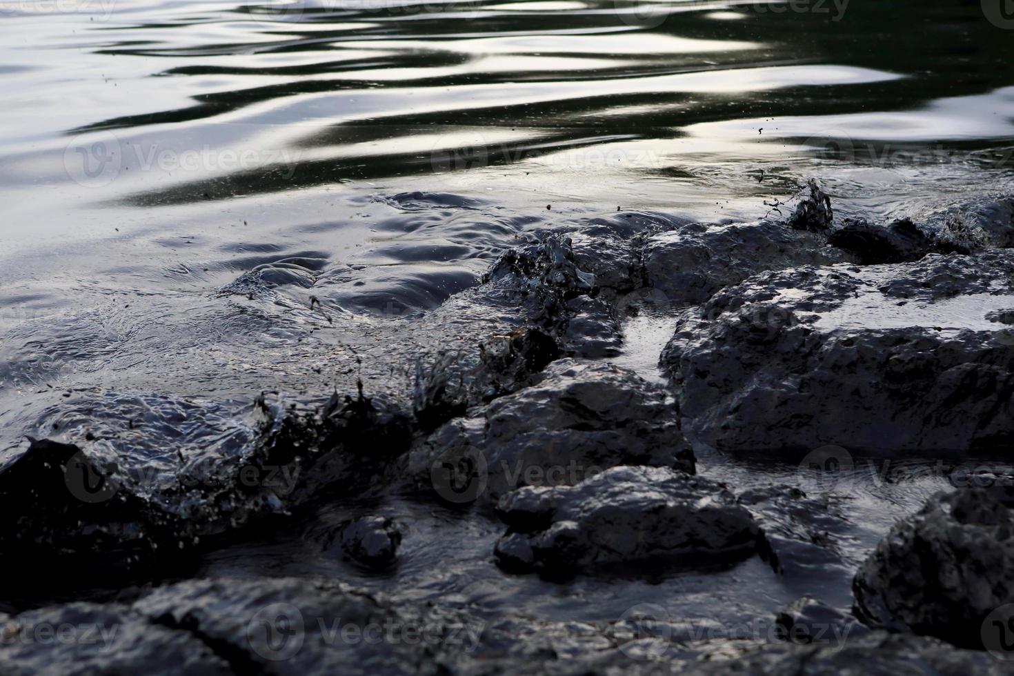 crude oil spill on the beach photo