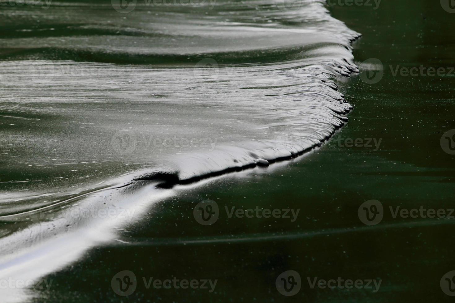 crude oil spill on the beach photo