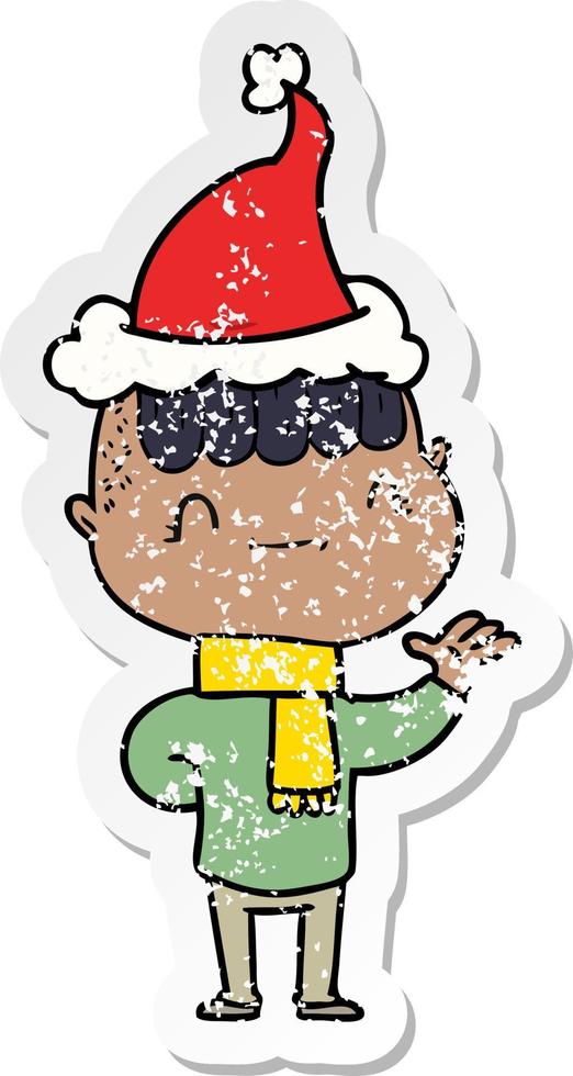 distressed sticker cartoon of a friendly boy wearing santa hat vector