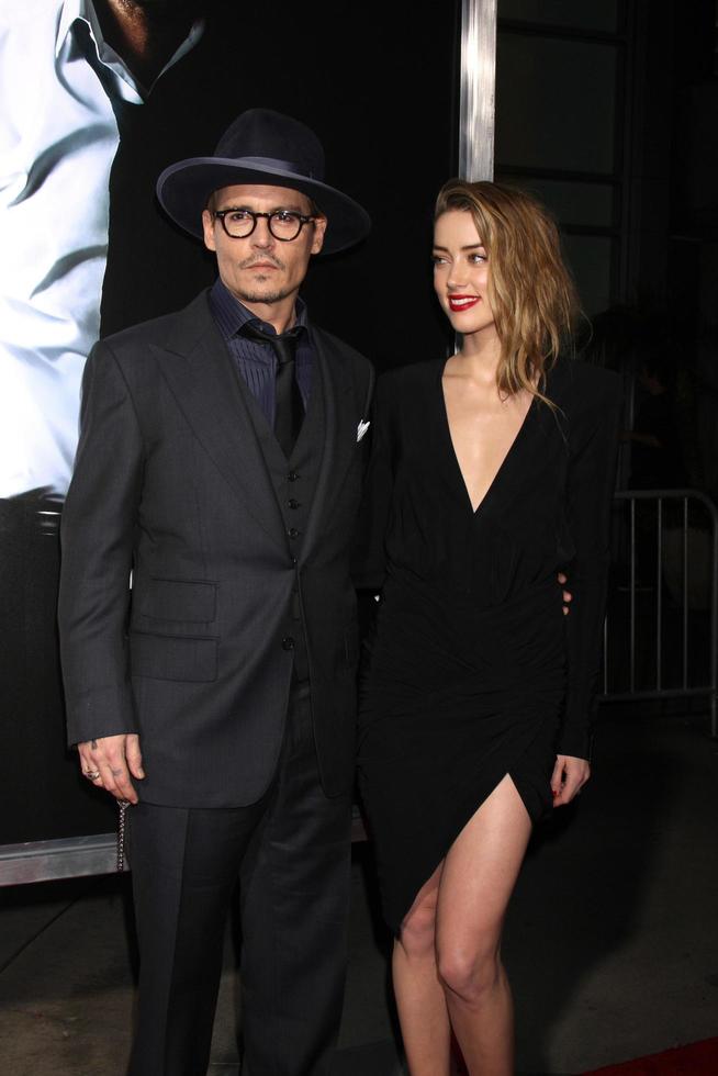 LOS ANGELES, FEB 12 -  Johnny Depp, Amber Heard at the 3 Days to Kill LA Premiere at ArcLight Hollywood Theaters on February 12, 2014 in Los Angeles, CA photo