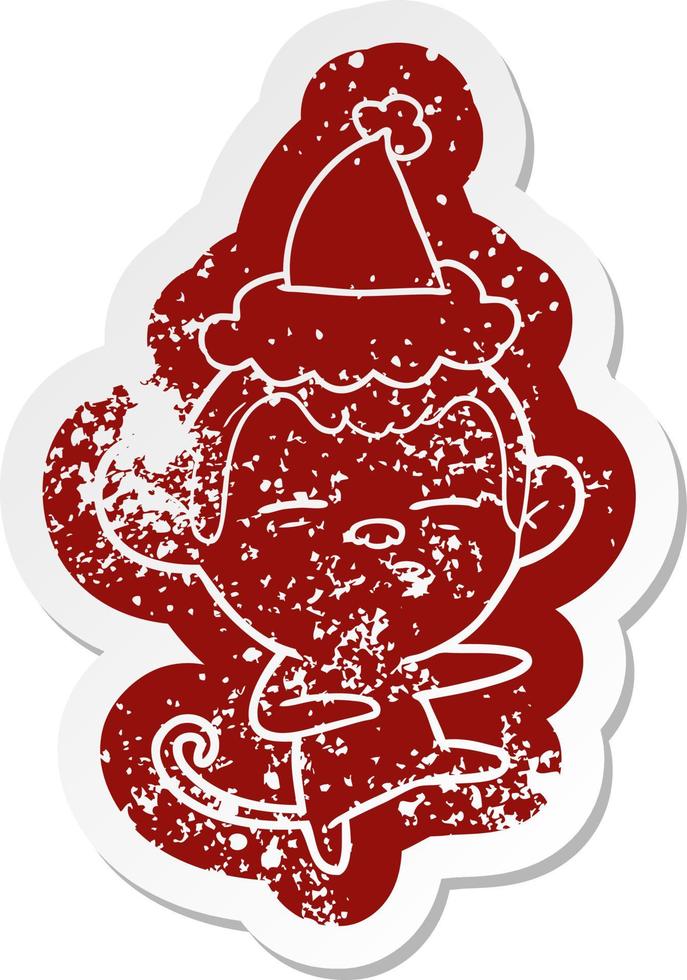 cartoon distressed sticker of a suspicious monkey wearing santa hat vector