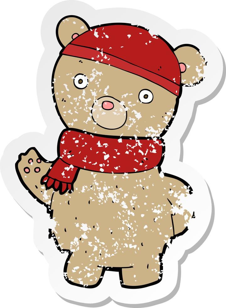 retro distressed sticker of a cartoon teddy bear in winter hat and scarf vector