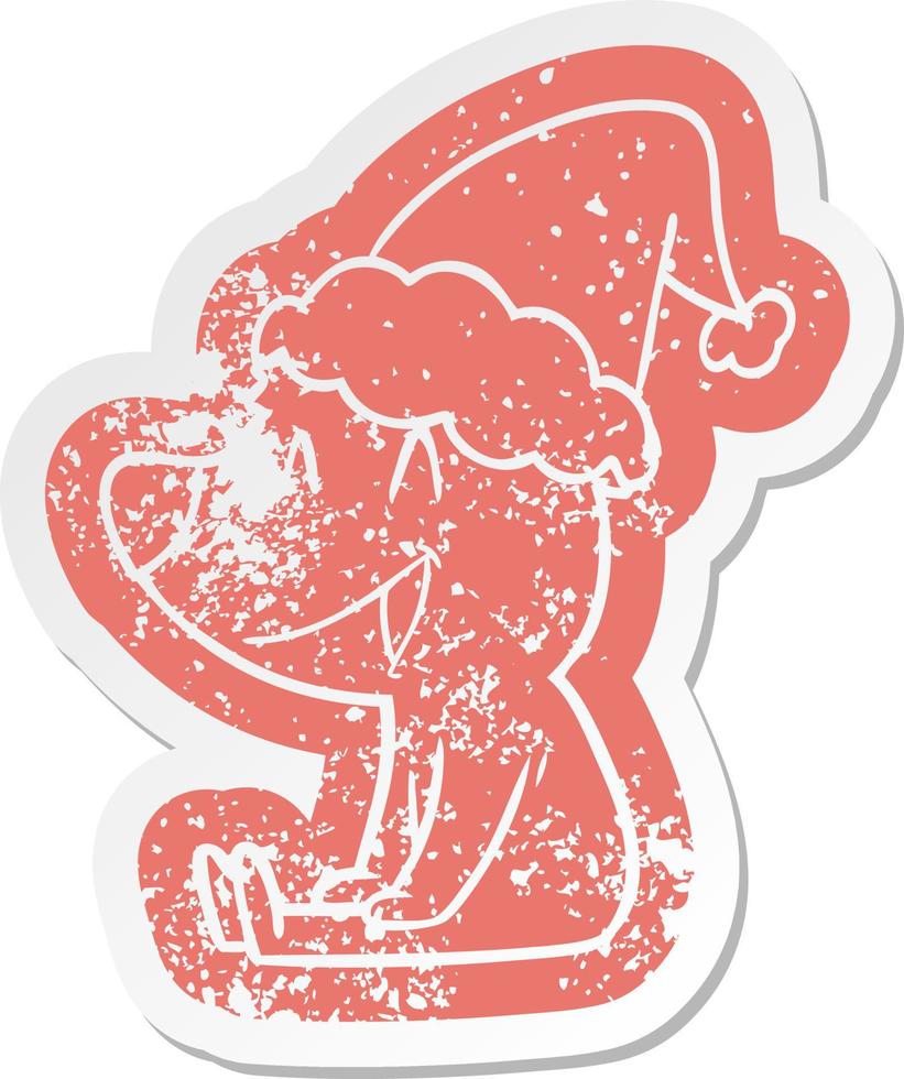 sitting bear cartoon distressed sticker of a wearing santa hat vector