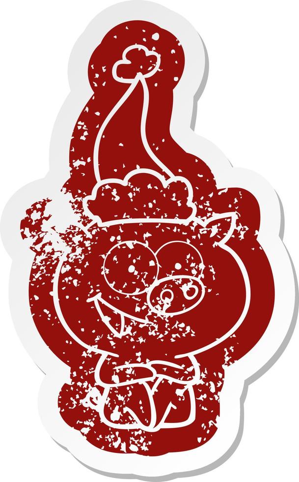 cheerful sitting pig cartoon distressed sticker of a wearing santa hat vector