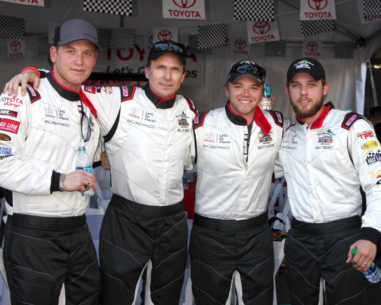 LOS ANGELES, APR 11 -  Cole Hauser, Phil Keoghan, Brett Davern, Max Thieriot at the 2014 Pro Celeb Race Qualifying Day at Long Beach Grand Prix on April 11, 2014 in Long Beach, CA photo