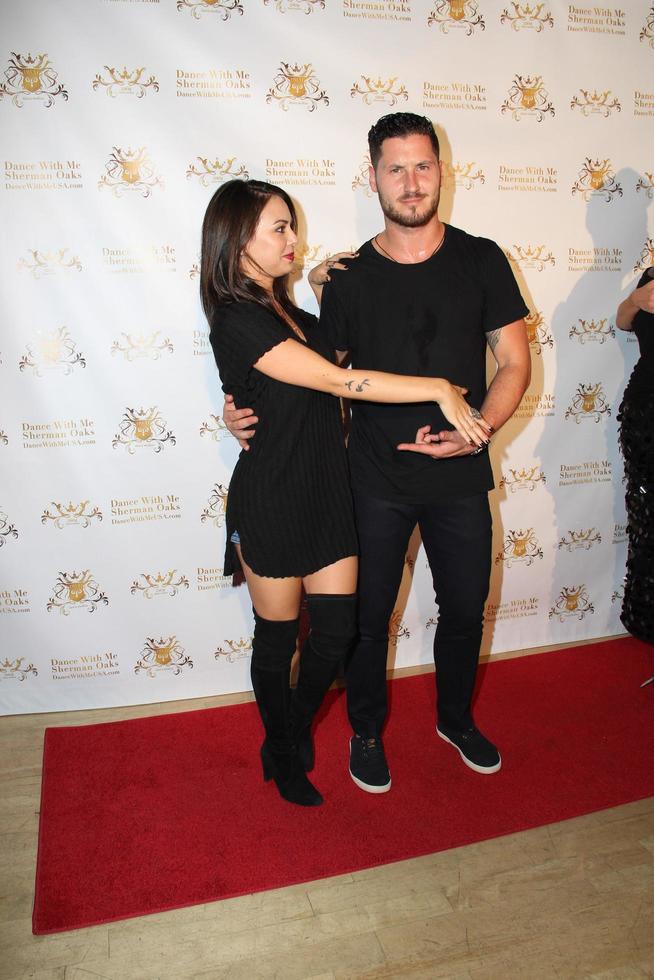LOS ANGELES, SEP 10 -  Janel Parrish, Valentin Chmerkovskiy at the Dance With Me USA Grand Opening at Dance With Me Studio on September 10, 2014 in Sherman Oaks, CA photo