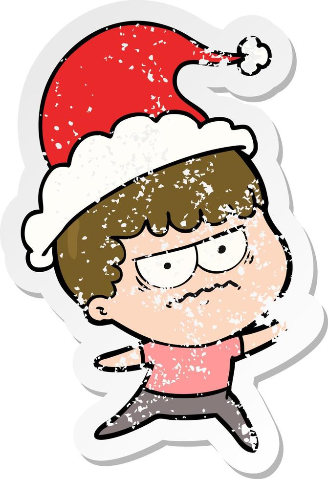 distressed sticker cartoon of a annoyed man wearing santa hat vector
