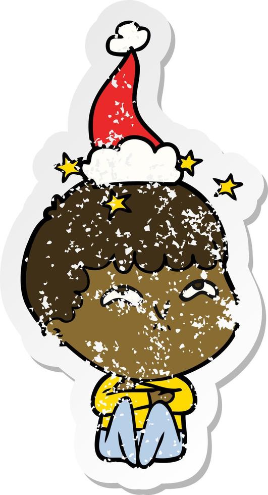 distressed sticker cartoon of a amazed boy wearing santa hat vector