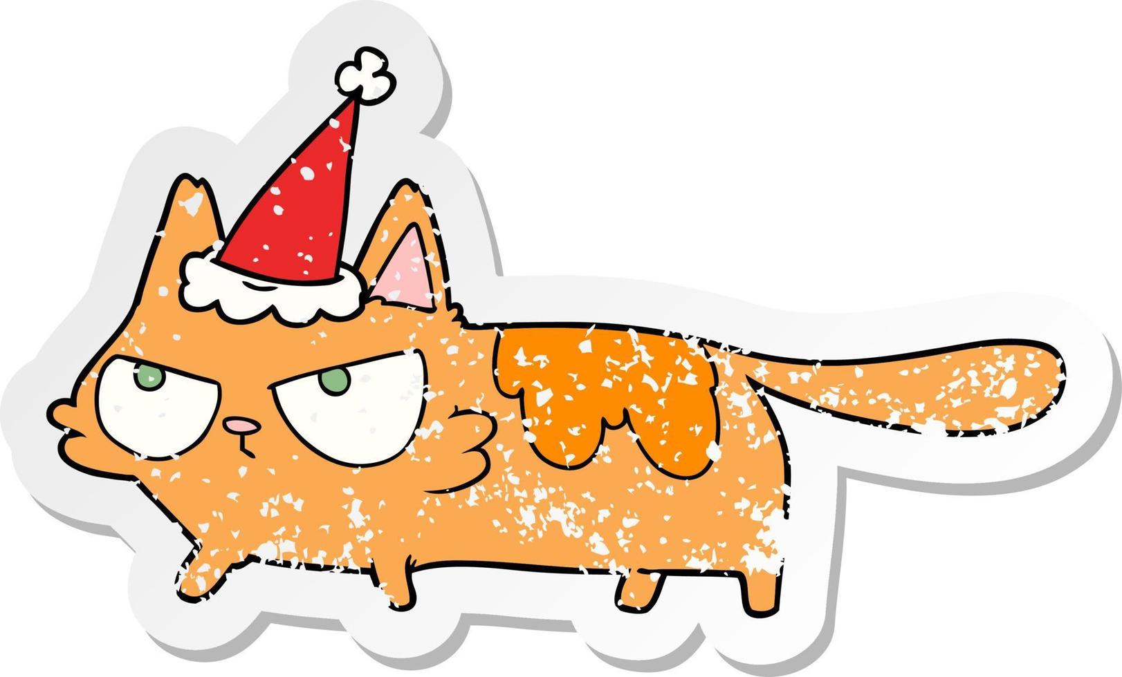 distressed sticker cartoon of a angry cat wearing santa hat vector