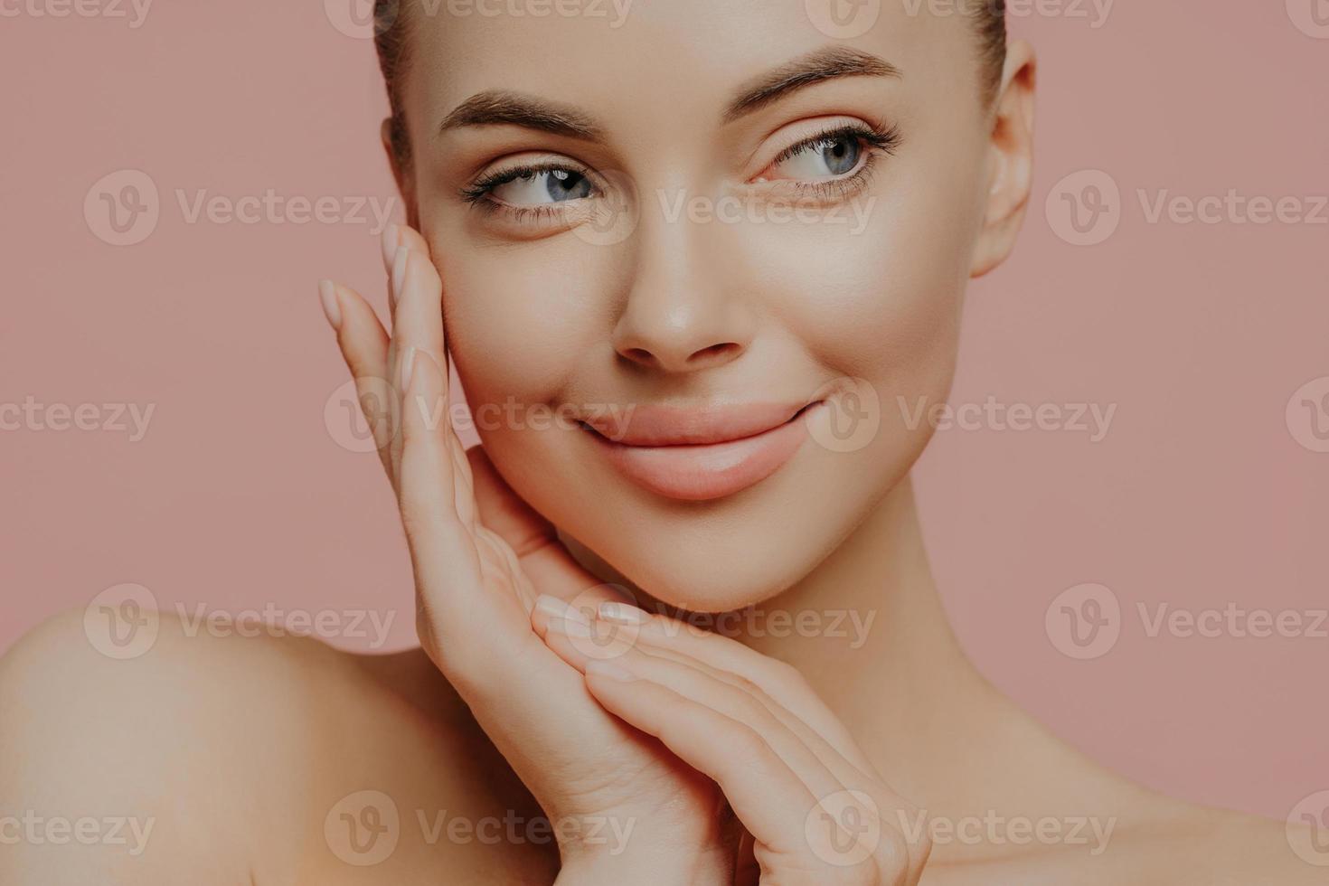 Beautiful young woman with clean fresh skin look away. Girl beauty face care. Facial treatment. Cosmetology, beauty and spa . photo