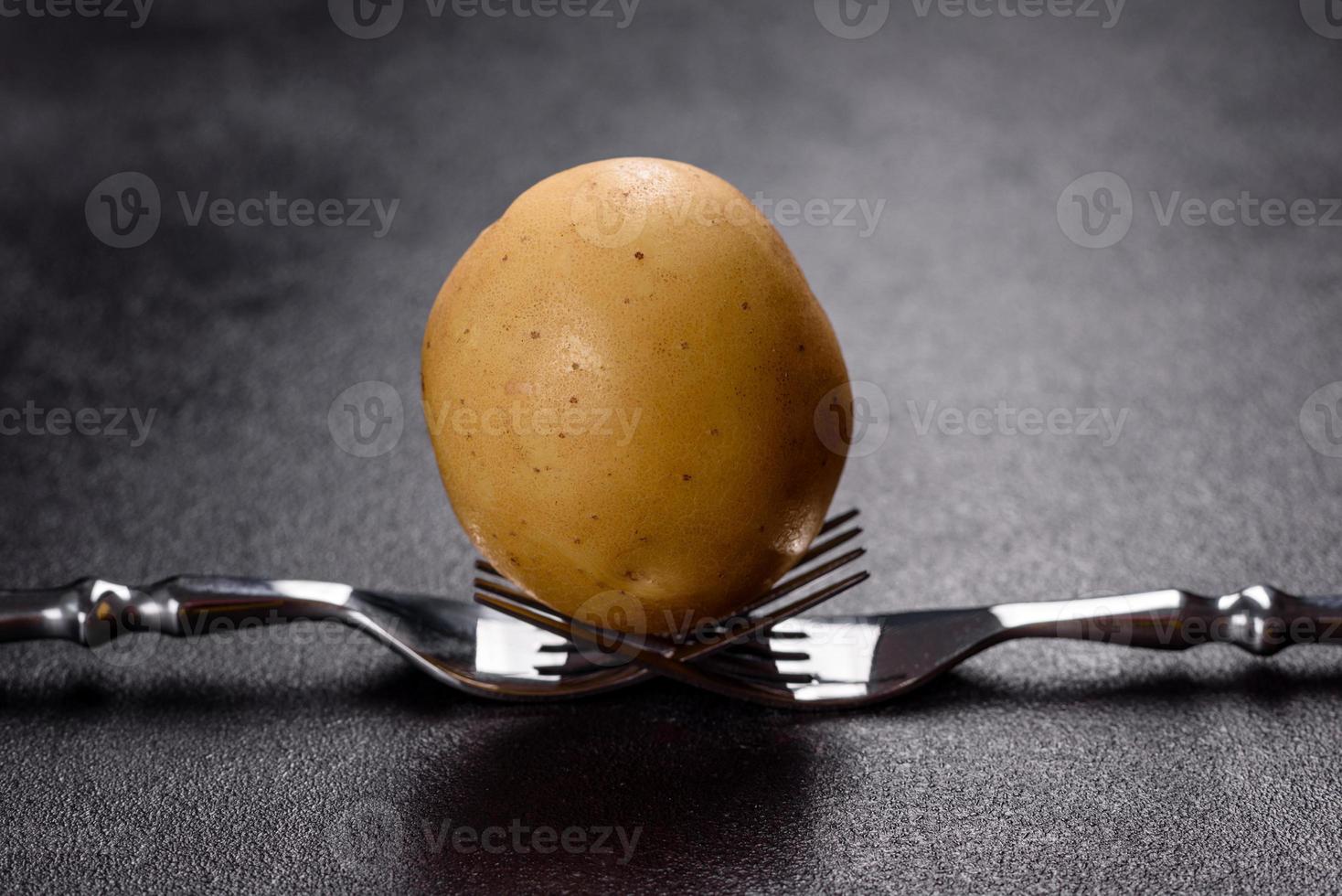 A pile of young potatoes on the table. The benefits of vegetables photo