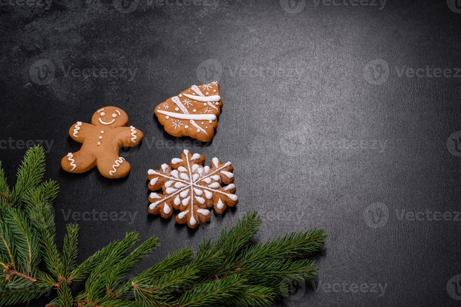 Beautiful delicious gingerbread gingerbread with Christmas tree branches photo