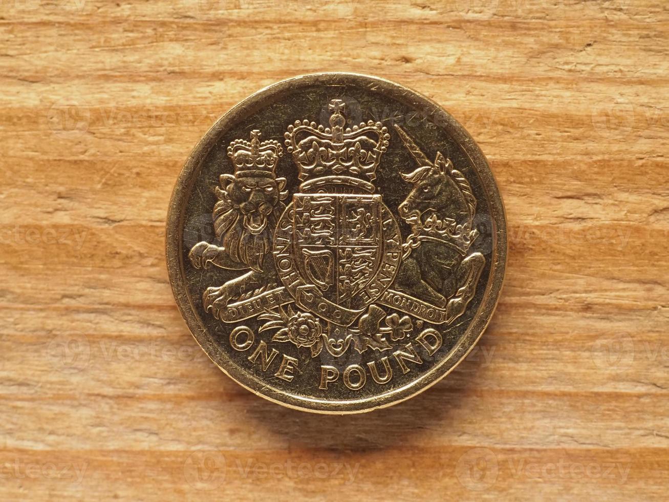 1 Pound coin, reverse side showing the Royal Arms, currency of t photo