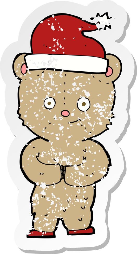 retro distressed sticker of a cartoon christmas teddy bear vector