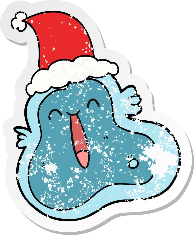 distressed sticker cartoon of a germ wearing santa hat vector