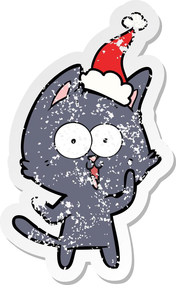 funny distressed sticker cartoon of a cat wearing santa hat vector