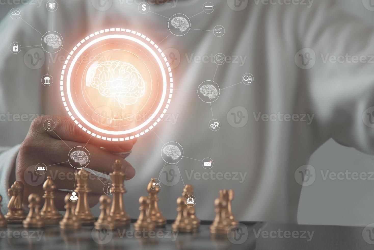 A businesswoman holding a light bulb in her hand, a chess board on the table, photo