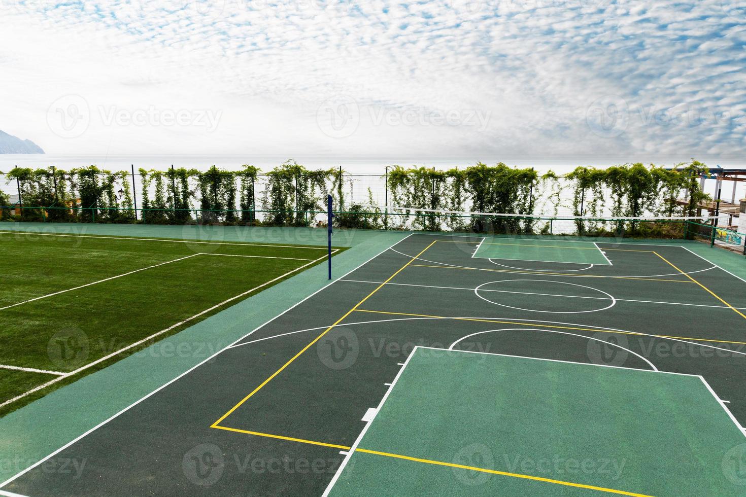 Outdoor Volleyball court with a net in the morning next to the sea. photo