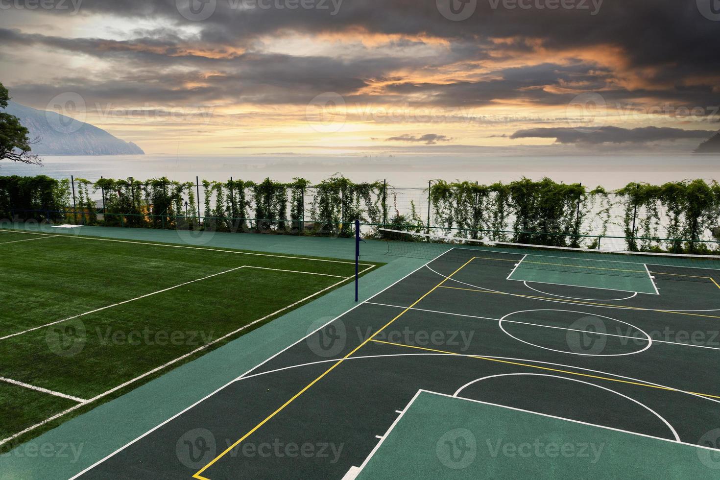 Outdoor Volleyball court with a net in the morning next to the sea. photo