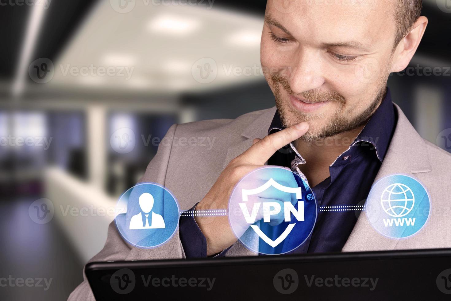 Business, technology, internet and networking concept. VPN network security internet privacy encryption concept. A man with a smile on his face and a laptop. photo
