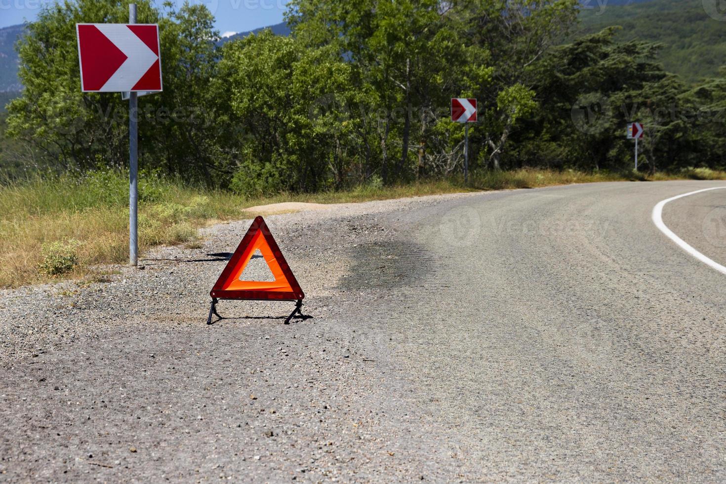 An emergency stop sign for a vehicle is installed on the road. Copy space. photo