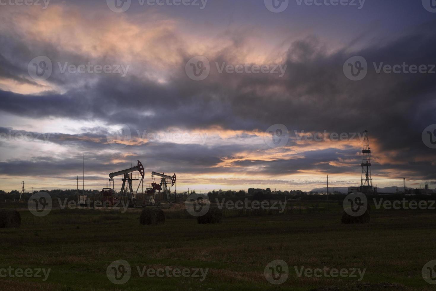 Oil industry. Oil rigs. oil pumps at sunset. Copy space. photo